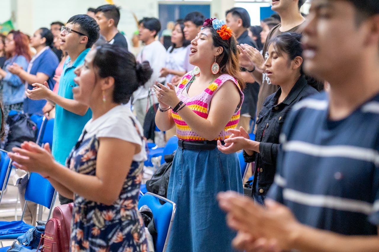 People passionately engaged in worship at a church in Ciudad de México, capturing cultural vibrancy.